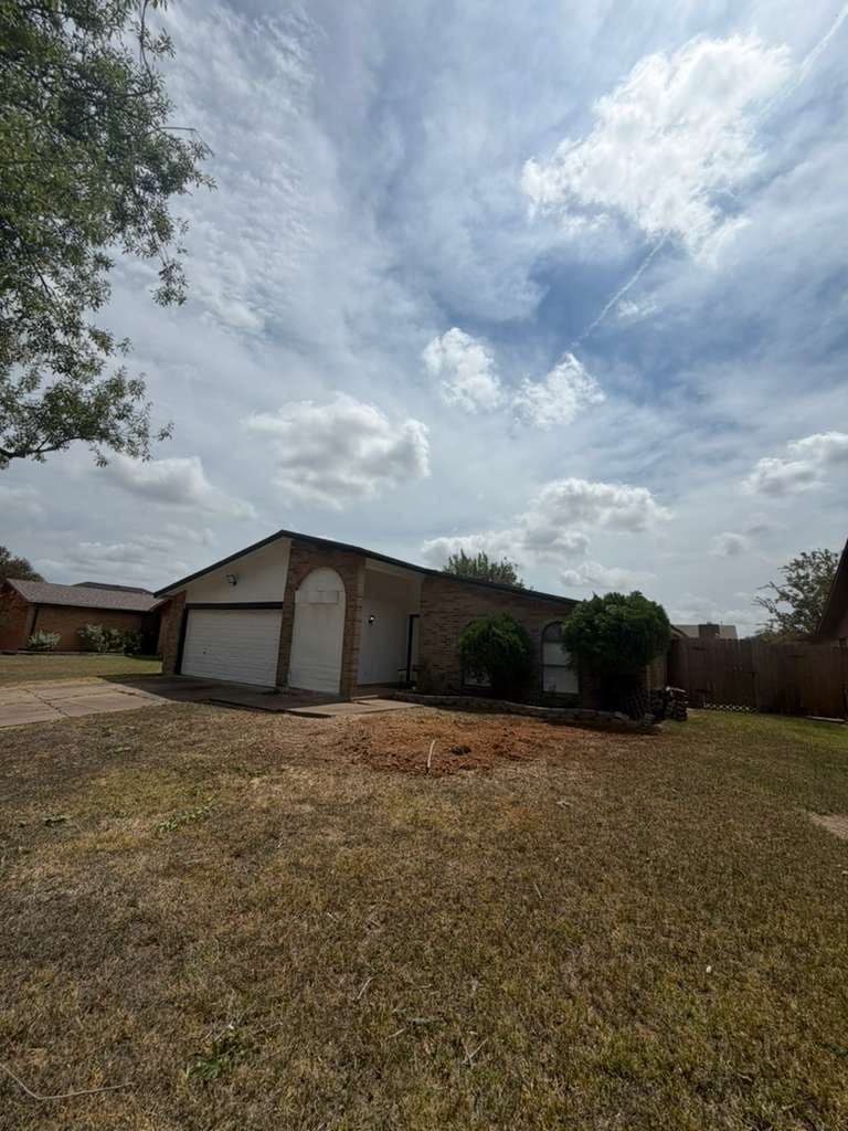Front yard with the tree and stump fully removed and the ground raked level